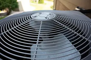 Heat Wave Prints: Top view of Residential air conditioning unit outdoors with fan and coils