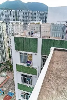 Hong Prints: The view of residential neighborhood and skyscrapers from rooftop in Hong Kong