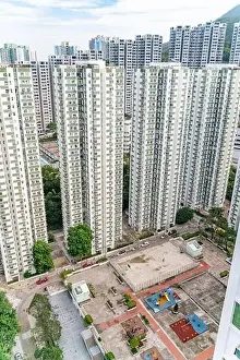Kong Prints: The view of residential neighborhood and skyscrapers from rooftop in Hong Kong