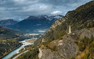 Grisons Prints: A view of the Rhine River in the Domleschg Valley and the Hochjuvalt fortress in autumn
