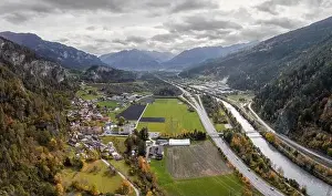 Swiss Alps Prints: A view of the Rhine and the village of Rothenbrunnen in southeastern Switzerland in autumn