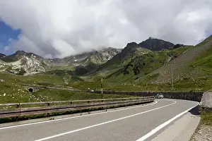 Mountain Pass Prints: View of the road and surrounding mountain landscape at Colle del Gran San Bernardo in Saint-Rhémy-en-Bosses