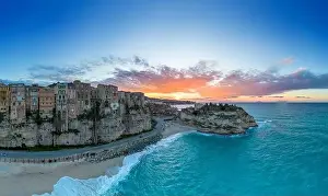 Nightfall Prints: View of Rotonda Beach and the colourful old town of Tropea in Calabria at sunset