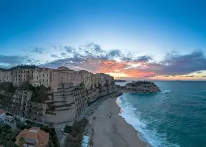 Nightfall Prints: View of Rotonda Beach and the colourful old town of Tropea in Calabria at sunset
