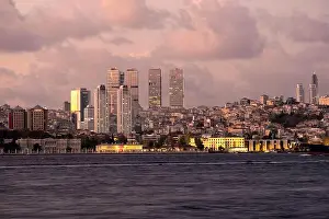 Water Night Prints: View on skyscrapers and Dolmabahce palace in european district of Istanbul at night