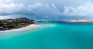 A view of the Spiaggia la Pelosa with the Pelosa Watchtower near Stintino in Sardinia