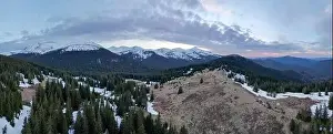 Mountain Peak Prints: A top view of the spring Carpathian mountains covered with snow from the bird view