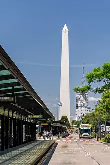 Obelisk Prints: View to street bus stop and historic obelisk in central Buenos Aires, Argentina