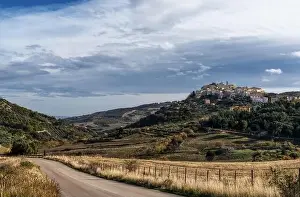 Basilicata Prints: A view of the town of Tolve in Basilicata with a country highway in the foreground