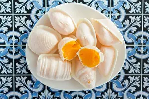 Wafer Prints: Top view of traditional portuguese egg yolk sweets called Ovos Moles de Aveiro on portuguese tiles background