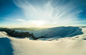 Hill Glacier Prints: Top view of an unforgettable ski slope covered with snow located in the mountains in the northern country on a sunny