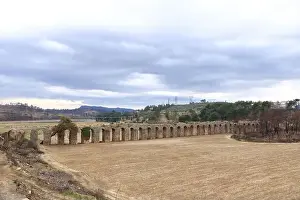 Railway Viaduct Prints: a view of viaduct arch bridge near small village in turkey