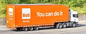 Transporting Prints: Side & back view white hgv supply chain delivery truck lorry & orange B&Q trailer You Can Do It retail business