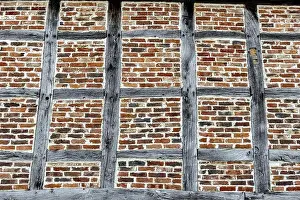 Bent Prints: View an windowless outside or house wall on a medieval half-timbered building with faches