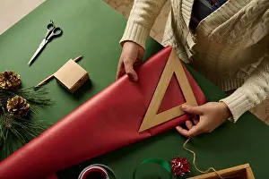 Merry Christmas Prints: Top view woman's hand using wooden ruler