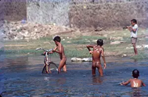 Village Boys Bathing in Lake Near Pune, Maharashtra, India