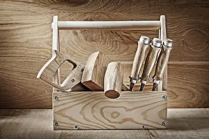 Carpenter Prints: Vintage carpenter tools in wooden box on wooden background