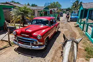 Country Road Prints: Vintage cars and horses share the road on a tour of the Vale de Selencio - VINALES, CUBA