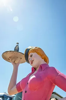 Forties Prints: vintage mannequin of female fast food barhop server on roller skates at with coke on a tray at Stars & Stripes classic