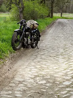 Mode Prints: A vintage motorcycle parked on the side of the road