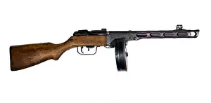 Reliable Prints: vintage submachine gun with drum magazine isolated