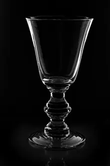 Goblet Prints: Vintage wine glass on black background with reflection