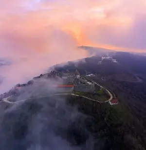 Visegrad, Hungary - Aerial panoramic drone view of the beautiful high castle of Visegrad on a moody winter morning