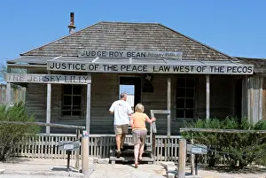 Saloon Prints: Visitors at the historic saloon courthouse of Judge Roy Bean The Law west of the Pecos in Langtry West Texas