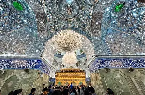 Reverence Prints: Visitors marvel at the beautiful chandeliers and mirror work of a Karbala shrine during a religious gathering