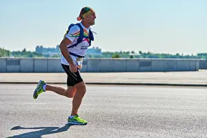 Feet Prints: Voronezh, Russia - 24.08.2019 - Young man runs along road