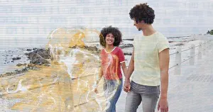 Curly Hair Prints: Walking couple holding hands along seaside promenade