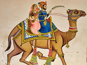 Udaipur Prints: Wall painting in Udaipur, Rajasthan, India, depicting a couple riding on a camel