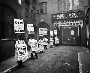 In A Row Prints: WARDOUR STREET, London. A line of men standing outside Mitchell Motors Company (114 Wardour Street)