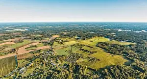 Completed Prints: Warm aerial earth curve panorama view over rural village with residental