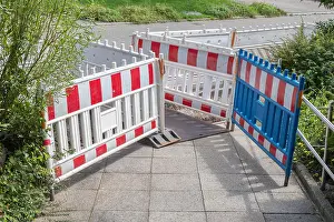 Under Construction Prints: Warning fences on a pavement - Surrounding an hole