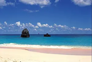 Warwick Long Bay Beach, Bermuda. Sea view with rock formations and yacht on horizon