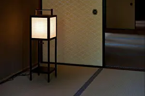 Kansai Prints: Washi paper and wood frame floor lantern casts a gentle glow in a tatami mat room inside the Hikone Castle Museum for a
