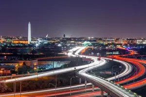 Washington, D.C. skyline with Highways and Monuments at dusk