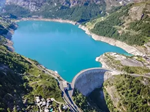 Power Plant Prints: Water dam and blue reservoir lake aerial view in Alps mountains generating hydroelectricity