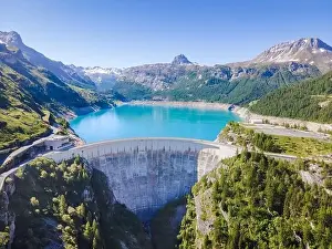 Power Plant Prints: Water dam and reservoir lake aerial view in Alps mountains in summer generating hydroelectricity