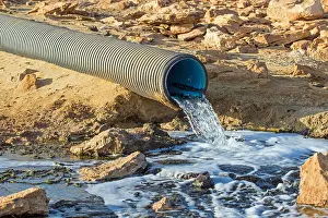 Flowing Water Prints: Water flowing out of pipe in desert, Santa Monica, Boa Vista, Cape Verde