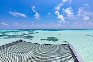Images Dated 3rd May 2018: Empty over water hammock in the middle of tropical lagoon in Maldives