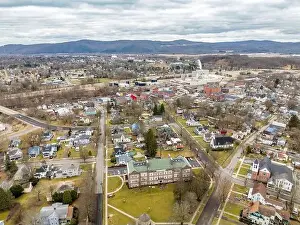 Penn York Valley Prints: Waverly, NY, USA - 03-03-2024 - Cloudy winter aerial image of the downtown area in the Village of Waverly