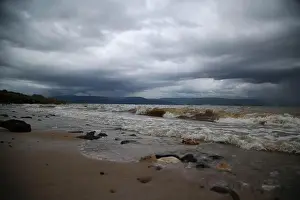 Accessibility Prints: The waves of the Sea of Galilee crash on the beach of, Israel