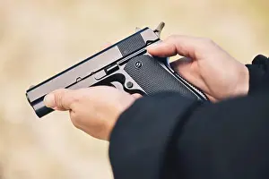 Firing Prints: Weapon, pistol and hands with gun outdoor for police