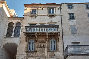 Weathered facade of a historic house in Split, Croatia, showcasing the timeless charm of the city's Old Town