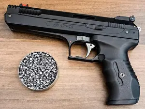 Pneumatic Prints: Weihrauch target and sport air pistol (made in Germany) and a tin of 4