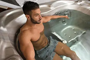 Bodybuilding Prints: Wellness Spa - Man Relaxing in Hot Tub Whirlpool Jacuzzi Indoors at Luxury Resort Spa Retreat - Handsome Young Male