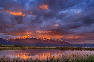 Chuck Haney Prints: Wetlands pond reflects the Mission Mountains at sunset at the Ninepipe National Wildlife Refuge near Ronan