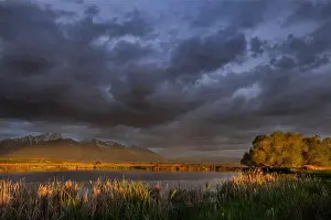 Chuck Haney Prints: Wetlands pond reflects the Mission Mountains at sunset at the Ninepipe National Wildlife Refuge near Ronan